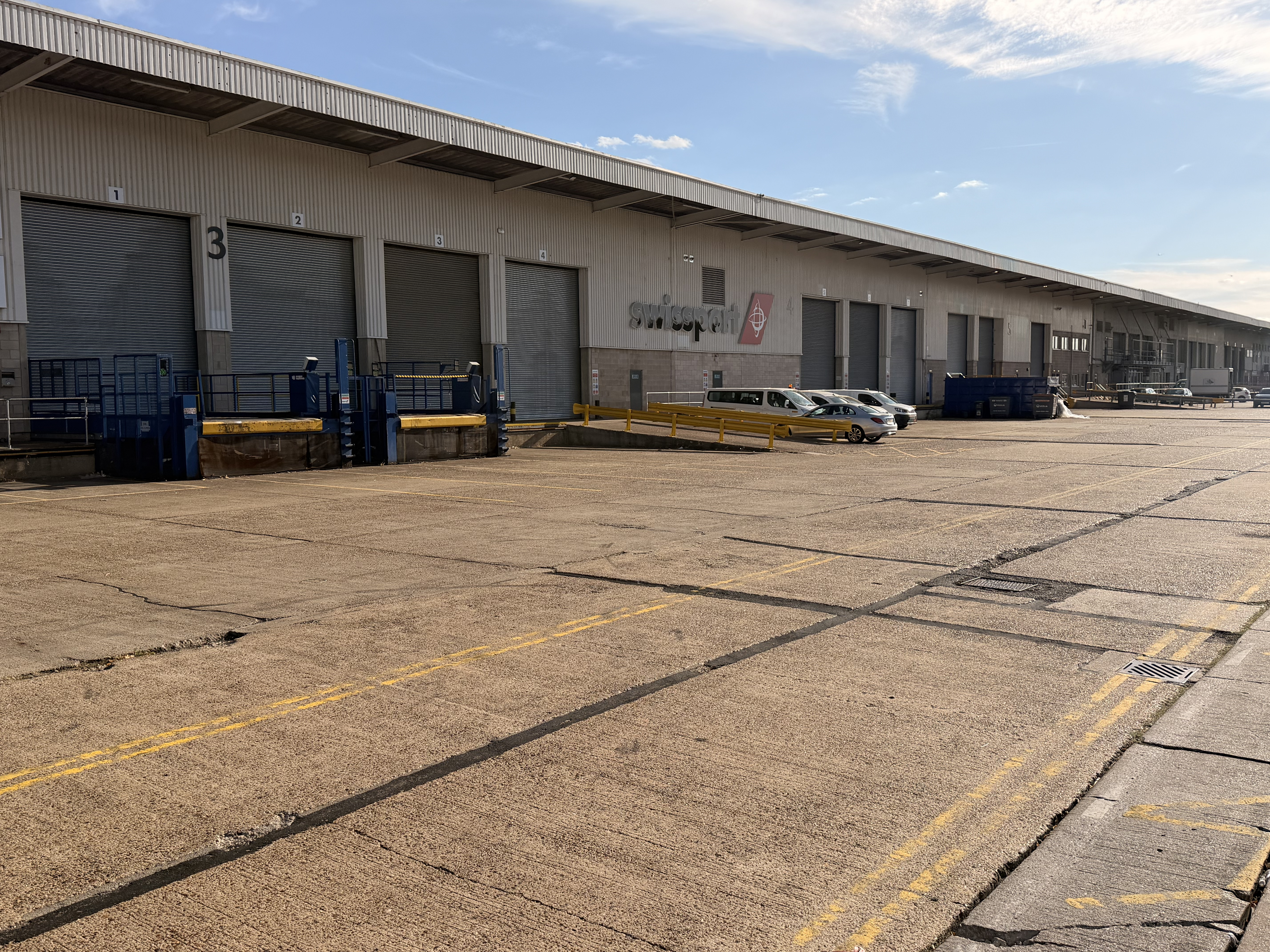S&B Transport fleet of white commercial vehicles lined up on site